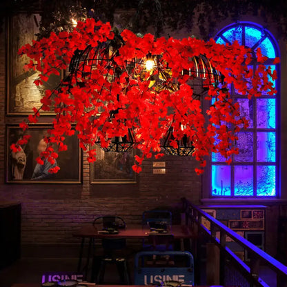 Decorbites red metal island ceiling light with vibrant red artificial flowers and black diamond cage industrial suspension lamp