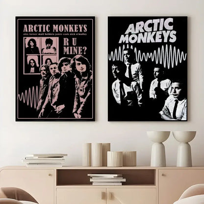Two framed retro Arctic Monkeys wall art posters in pink and black wave design and black and white style