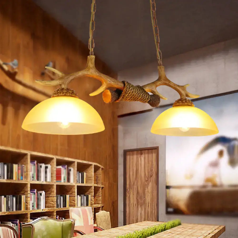 DecorBites™ retro dome pendant light set featuring beige glass shades and decorative deer horn with rustic wood finish