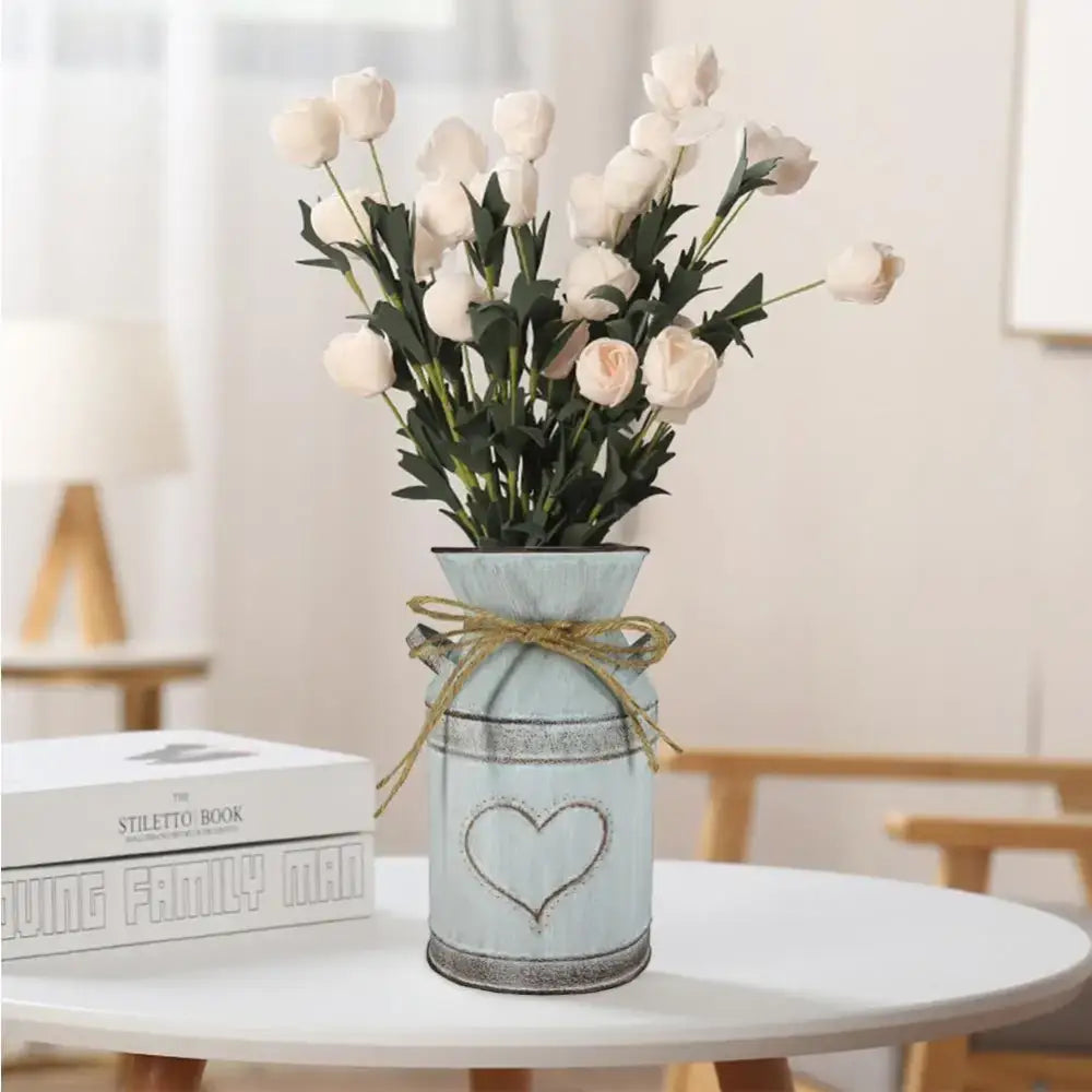 DecorBites™ retro floral light blue distressed metal vase holder with heart design and rustic twine bow holding tulips