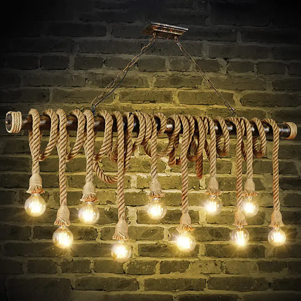 Rustic industrial chandelier with thick beige hemp rope exposed wrapped around dark metal pipe with glowing bulbs