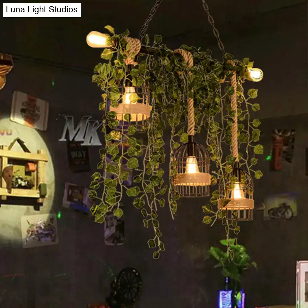 DecorBites™ retro metal island light with three wrought iron birdcage lamps, pink green flower drops, and ivy accents