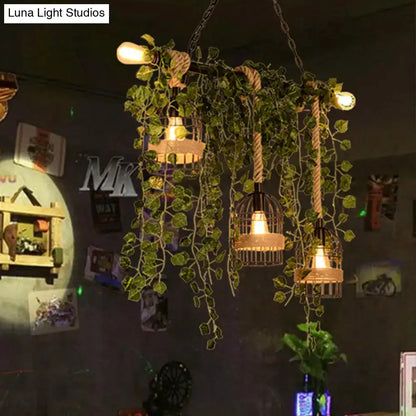 DecorBites™ retro metal island light with three wrought iron birdcage lamps, pink green flower drops, and ivy accents