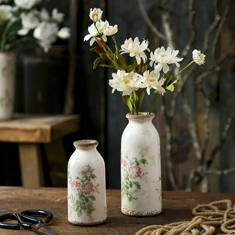 White ceramic vase with faded floral design and rustic chipped glaze in decorbites retro nordic ceramic vases for home decor