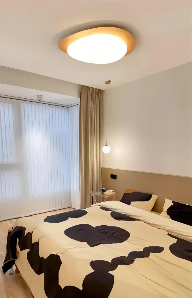 Modern circular ceiling light by decorbites with walnut color frame and soft white illumination for living room use