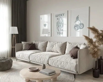 Beige upholstered sectional sofa with rounded armrests paired with decorbites™ retro wall art posters set queen of hearts