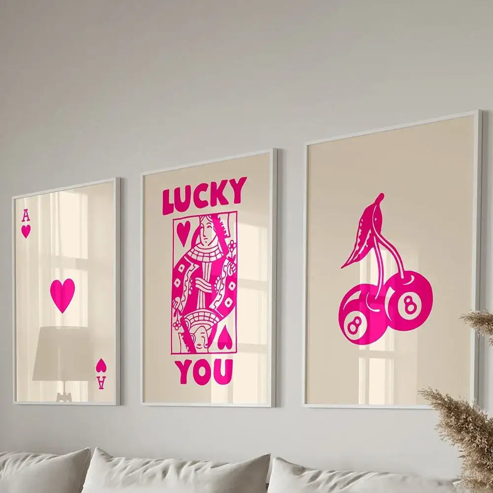 Three framed decorbites™ retro wall art posters set featuring vibrant pink queen of hearts poker-themed designs on beige