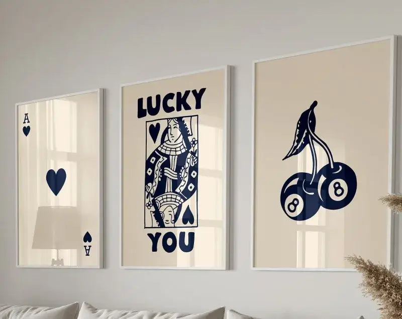 Three framed DecorBites™ retro wall art prints featuring navy blue playing card designs on cream backgrounds