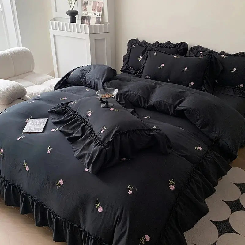 Black ruffled duvet cover set with delicate pink rose embroidered floral design by DecorBites™ princess style