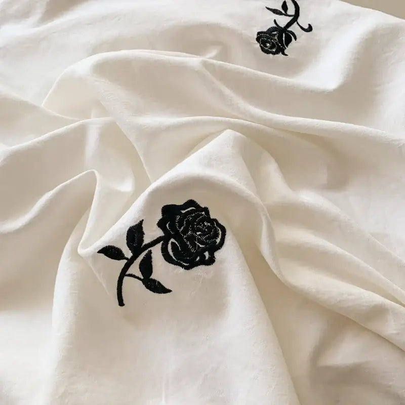 White fabric duvet cover set with black rose embroidered design from DecorBites™ princess style rose embroidered duvet