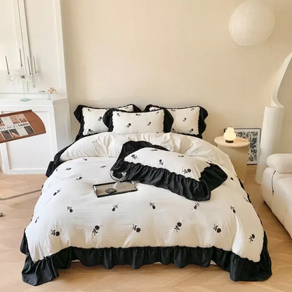 Decorbites™ rose embroidered duvet set featuring black and white floral embroidery with ruffled edges in princess style