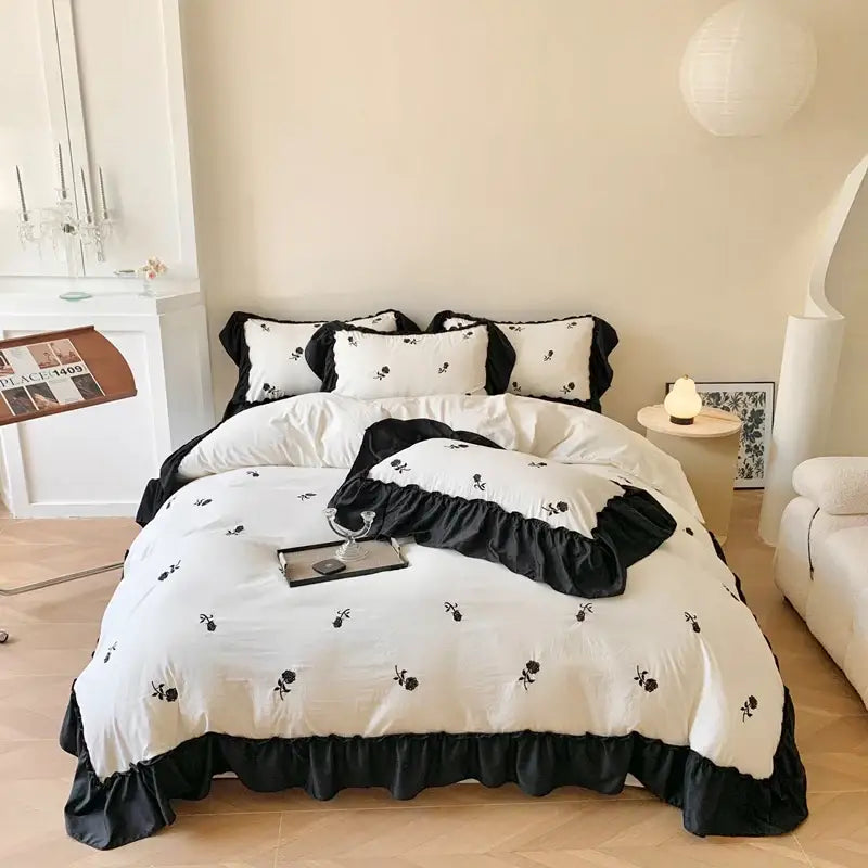 Decorbites™ rose embroidered duvet set featuring black and white floral embroidery with ruffled edges in princess style