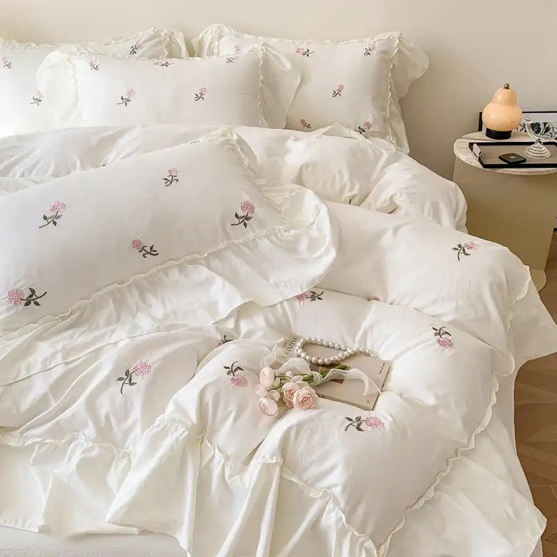 White ruffled duvet set with delicate pink and black rose embroidered floral embroidery from decorbites princess style