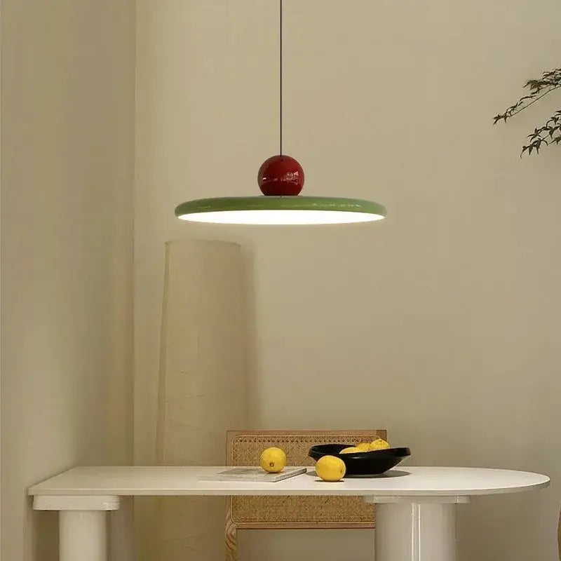 DecorBites™ rotatable Nordic LED pendant light features a glossy red spherical top with a flat green iron shade