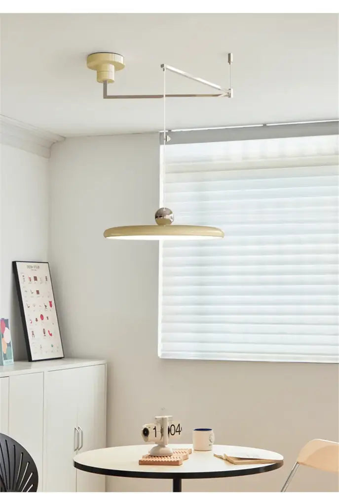 Decorbites™ rotatable nordic led pendant light with sleek matte gold finish and circular disc shade suspended by metal arm