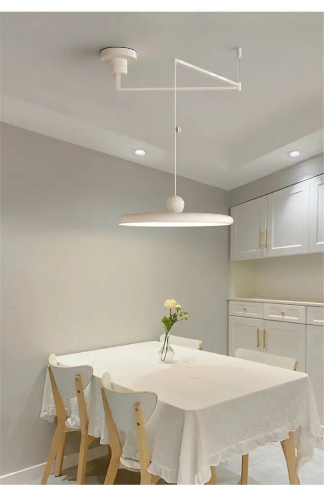 Modern cream iron decorbites™ rotatable nordic led pendant light with circular shade and angular arm design