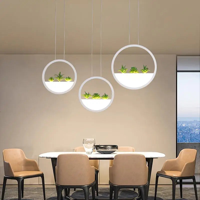 DecorBites™ round planter led chandelier with modern white acrylic frames housing glowing led panels and green succulents