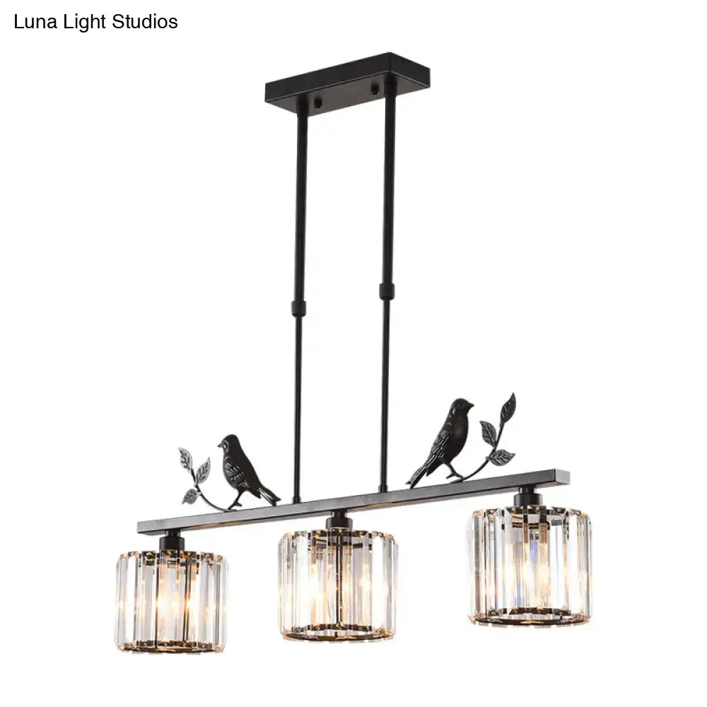 Black metal chandelier with three cylindrical crystal shades and bird motifs for dining room crystal island lighting