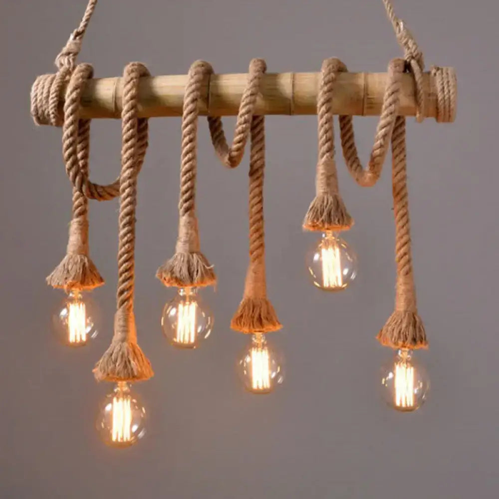 DecorBites™ rustic brown island pendant light with bamboo pole, thick beige rope, frayed tassels, and glass bulb fixtures