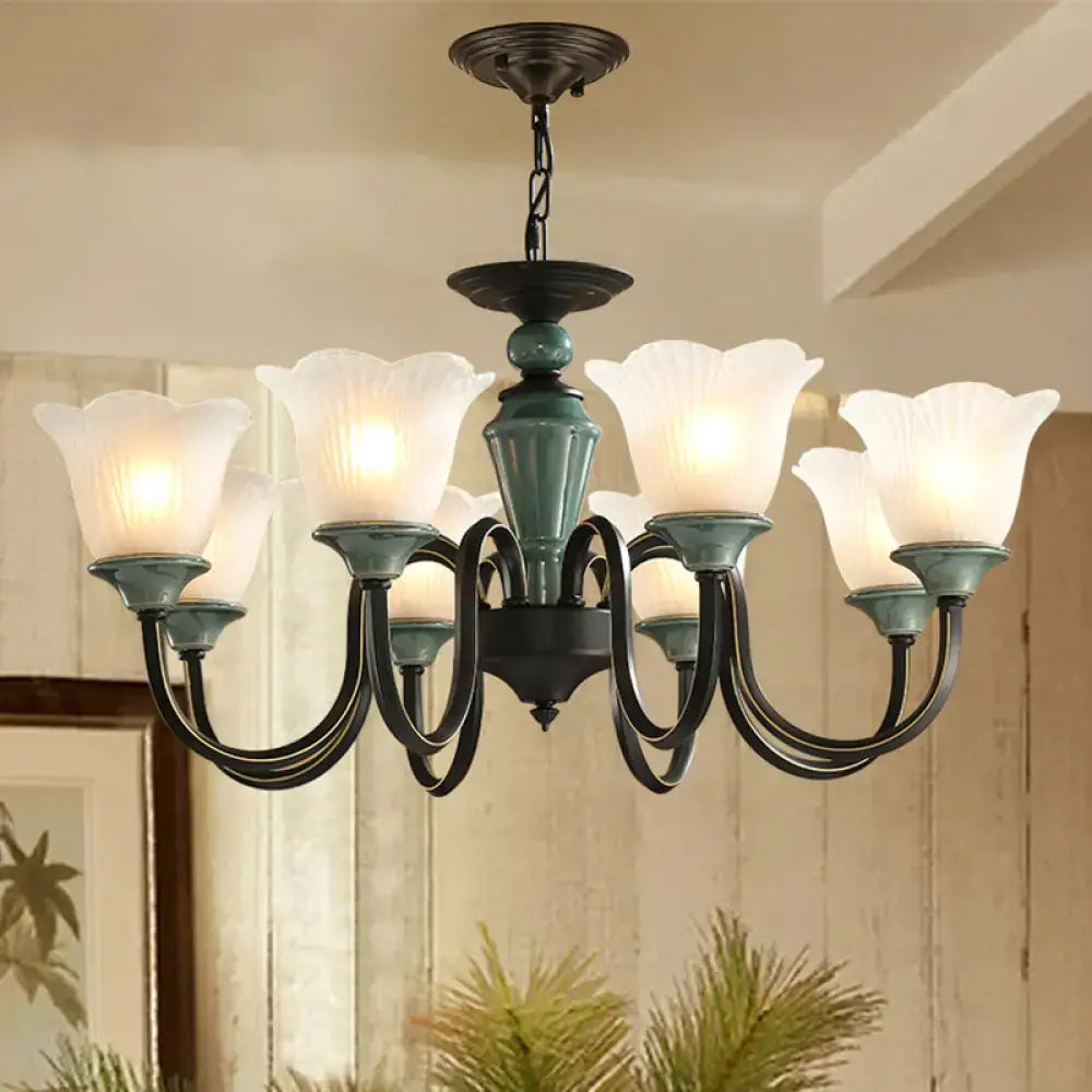 Antique bronze and teal glass rustic floral chandelier with blackish green suspension and frosted glass shades for living room