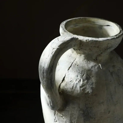 Weathered white rustic handmade ceramic vase with sturdy handle and visible cracks for home decor by DecorBites
