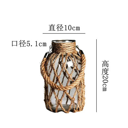 Decorbites™ rustic hanging glass vase featuring clear glass, hemp rope netting, and metal hardware accents