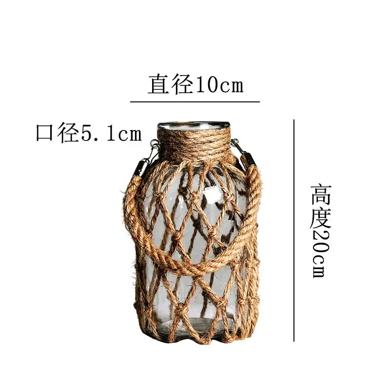Decorbites™ rustic hanging glass vase featuring clear glass, hemp rope netting, and metal hardware accents