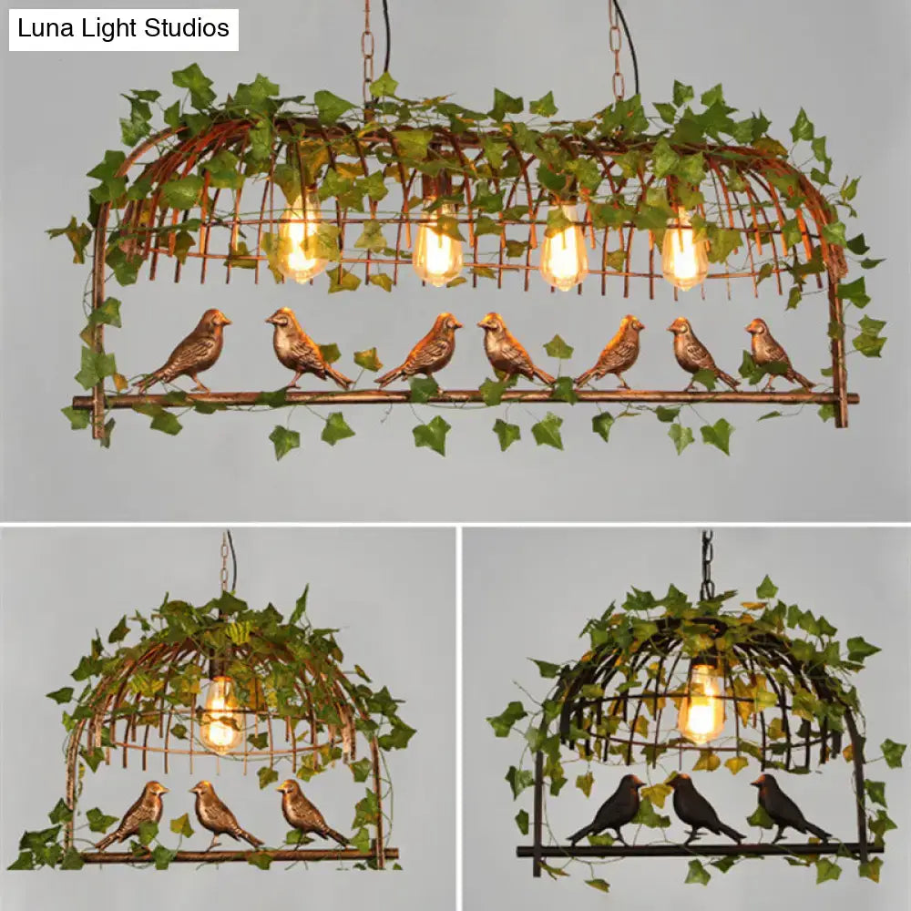 DecorBites rustic island ceiling light features a copper-toned cast iron birdcage with green ivy and exposed filament bulbs