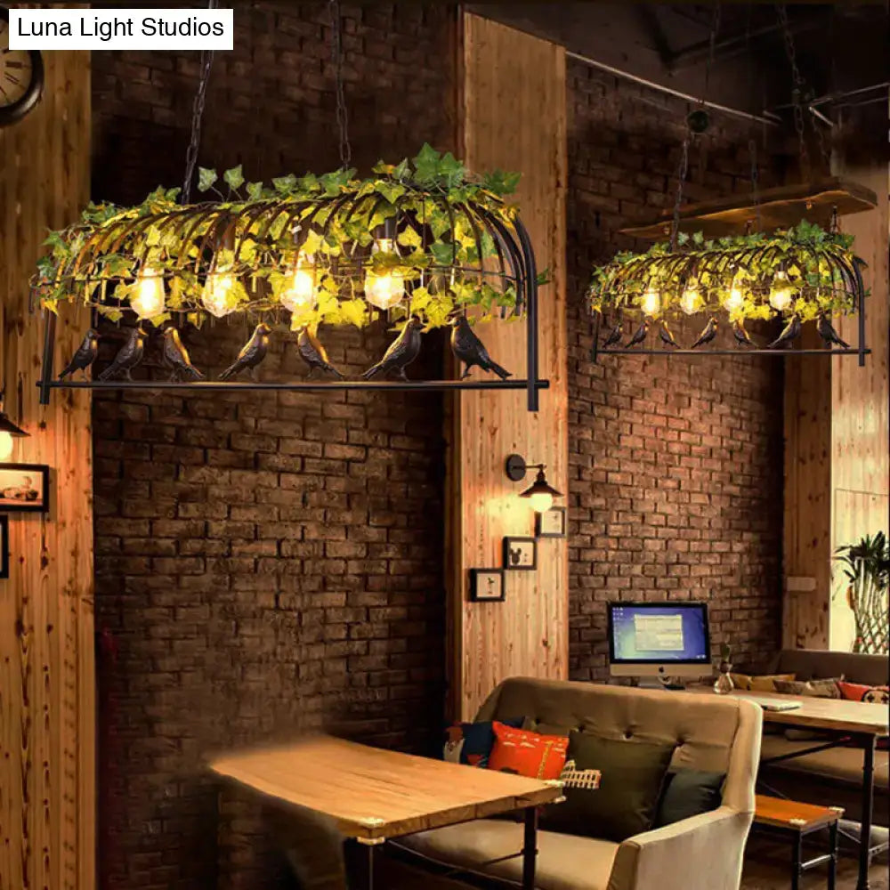 Wrought iron rustic island ceiling light with green ivy and black cast iron bird accents industrial style ceiling light