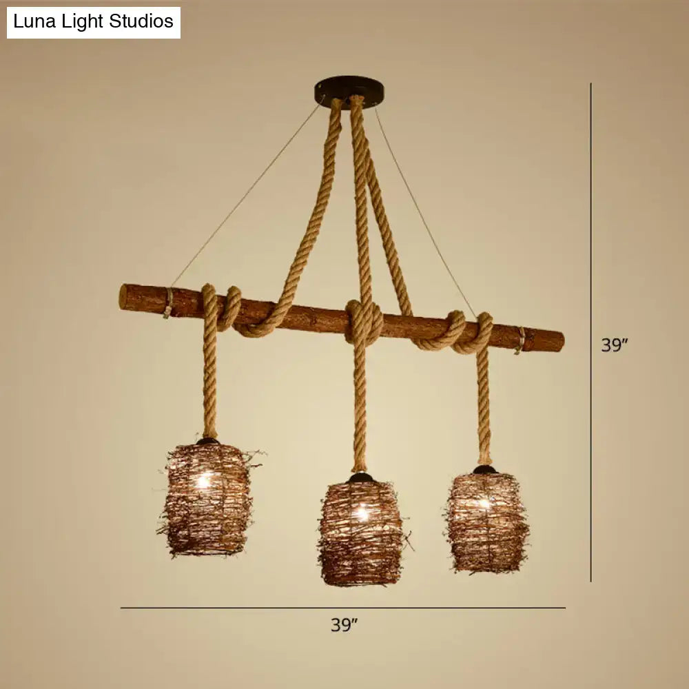 Rustic rattan woven island pendant light fixture with three brown rope lights hanging in dining room space
