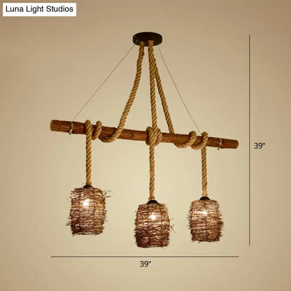 Rustic rattan woven island pendant light fixture with three brown rope lights hanging in dining room space