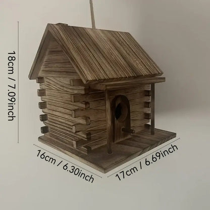 Rustic wooden birdhouse with slanted roof and arched entrance designed for hummingbirds and small birds by decorbites