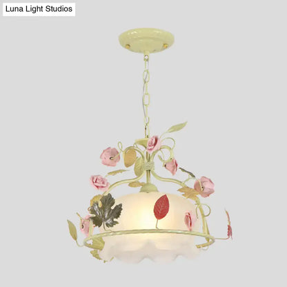 Pastel yellow scallop chandelier light fixture with pink roses green leaves and frosted opal glass shade for living room