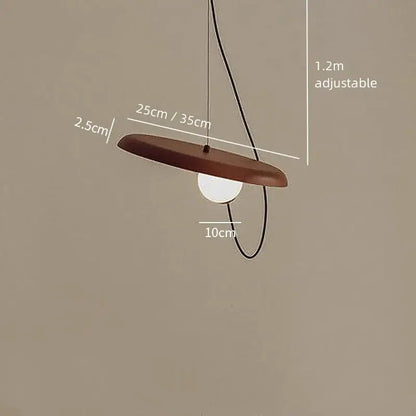 Brown wooden disc pendant light with white bulb and black cord in decorbites scandinavian pendant light design