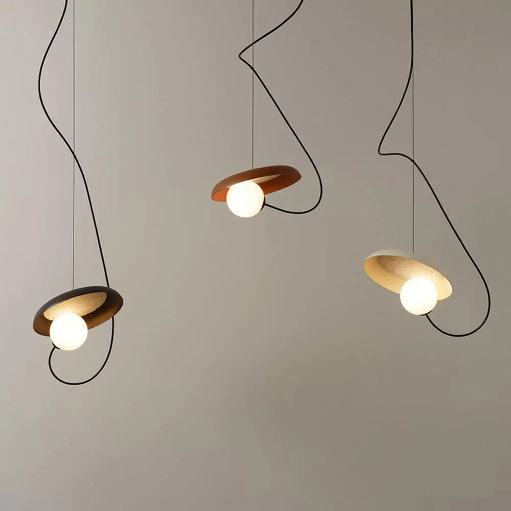 Decorbites™ scandinavian pendant light with three circular wooden shades, curved black cords, and glowing white bulbs