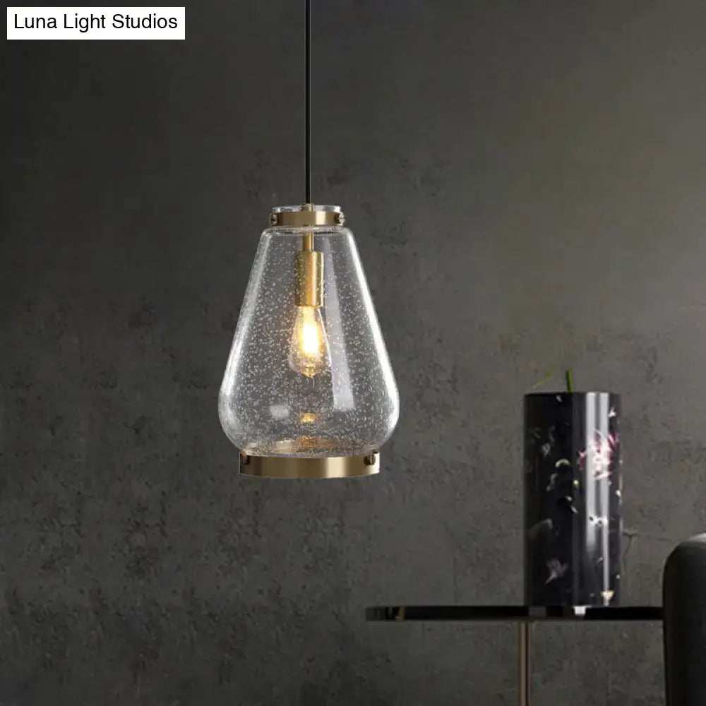 DecorBites™ seeded glass pendant light with textured clear glass shade and brass rim perfect for bedrooms