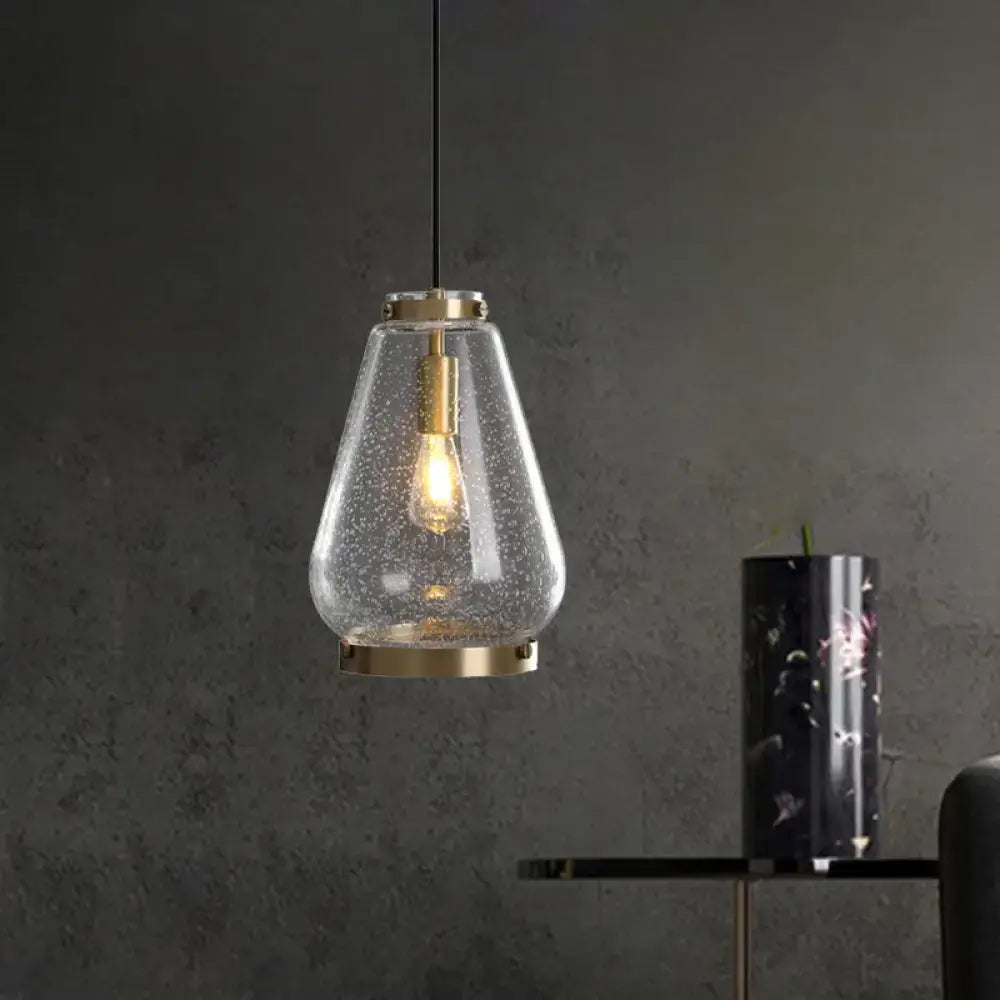 DecorBites™ seeded glass pendant light with textured clear glass shade and brass rim perfect for bedrooms