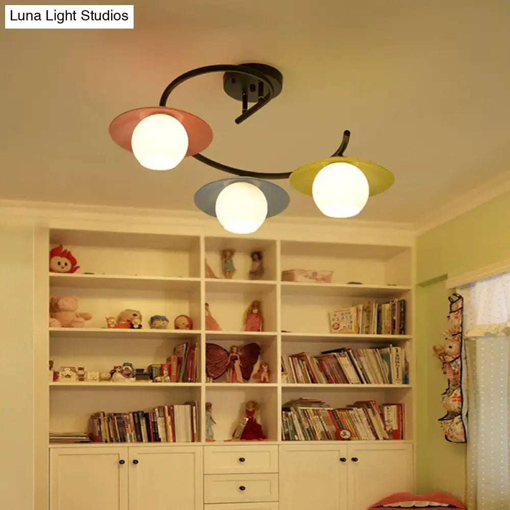 DecorBites semi flush light with three pastel glass shades in pink blue and yellow on a black metal frame