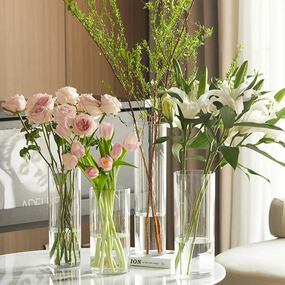 Decorbites shatterproof clear acrylic cylinder vase holding pink roses tulips and white lilies in clear acrylic cylinder