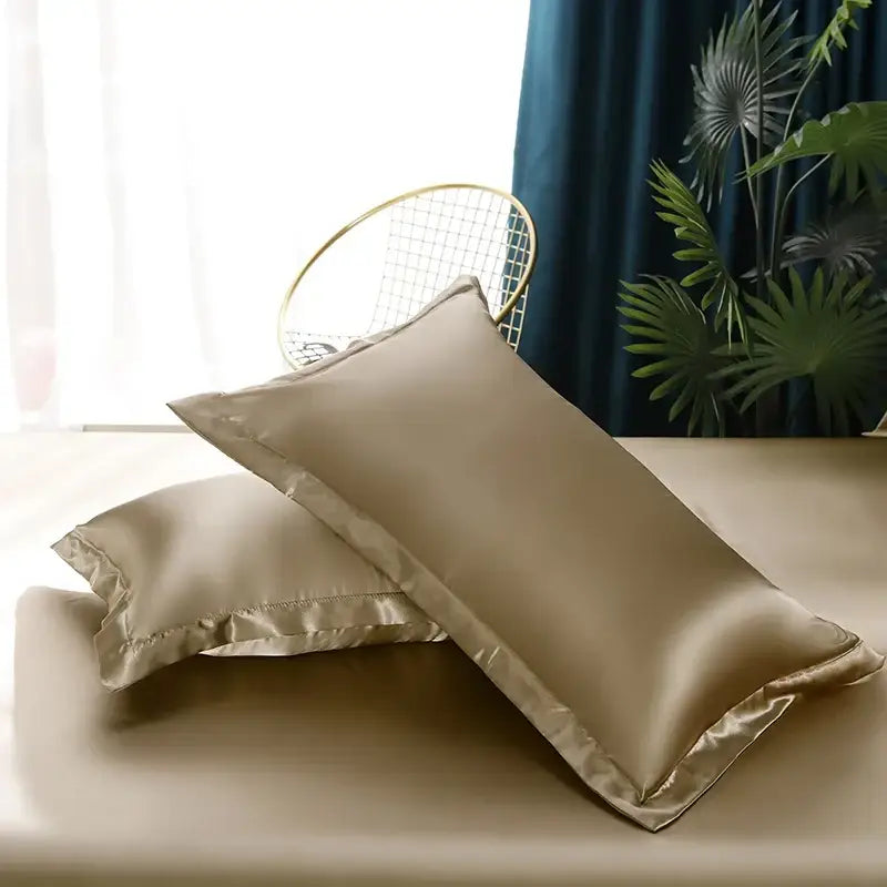 Pair of elegant champagne-colored silk pillowcases with subtle sheen from the DecorBites™ pcs duvet cover set for width bed