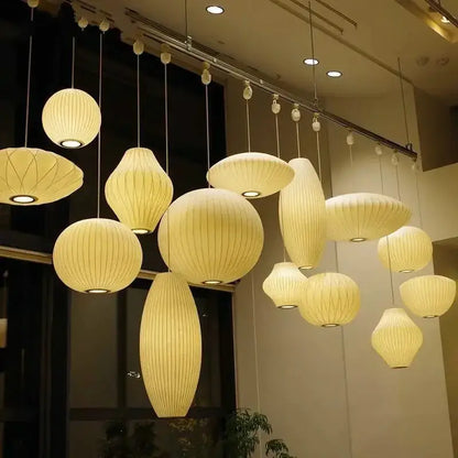Cream-colored ribbed silk led pendant lamp collection by decorbites in organic shapes for modern designer lighting