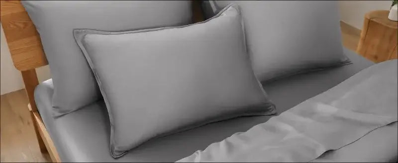 Gray rectangular pillow with soft smooth fabric and neatly stitched edges from decorbites silky cooling duvet cover set