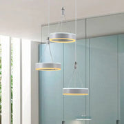 Modern white and silver cluster ceiling light with warm yellow led rings ideal for dining room illumination