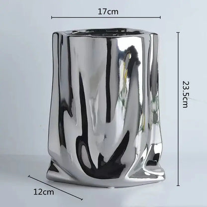 DecorBites silver ruffled ceramic flower vase with shiny metallic reflective surface and sculpted irregular body