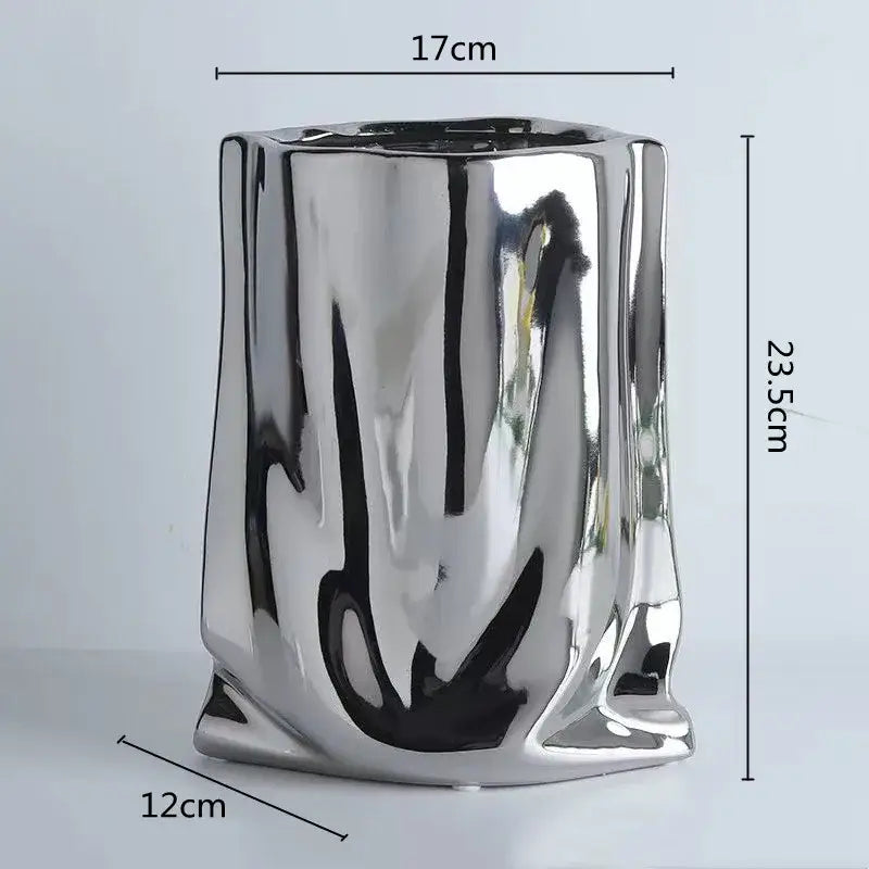DecorBites silver ruffled ceramic flower vase with shiny metallic reflective surface and sculpted irregular body