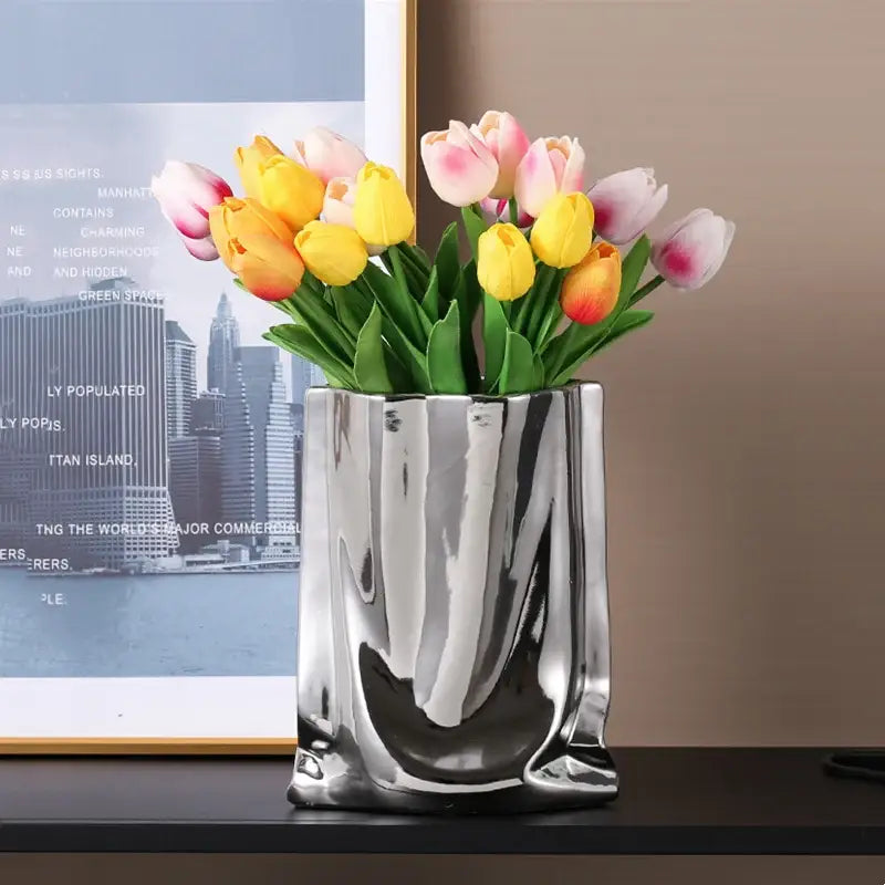 DecorBites silver ruffled flower vase in sleek silver ceramic holds vibrant yellow and pink tulip bouquet
