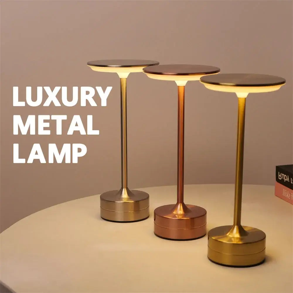 Three elegant metal desk lamps in gold and rose gold with simple charging led and dimming atmosphere features