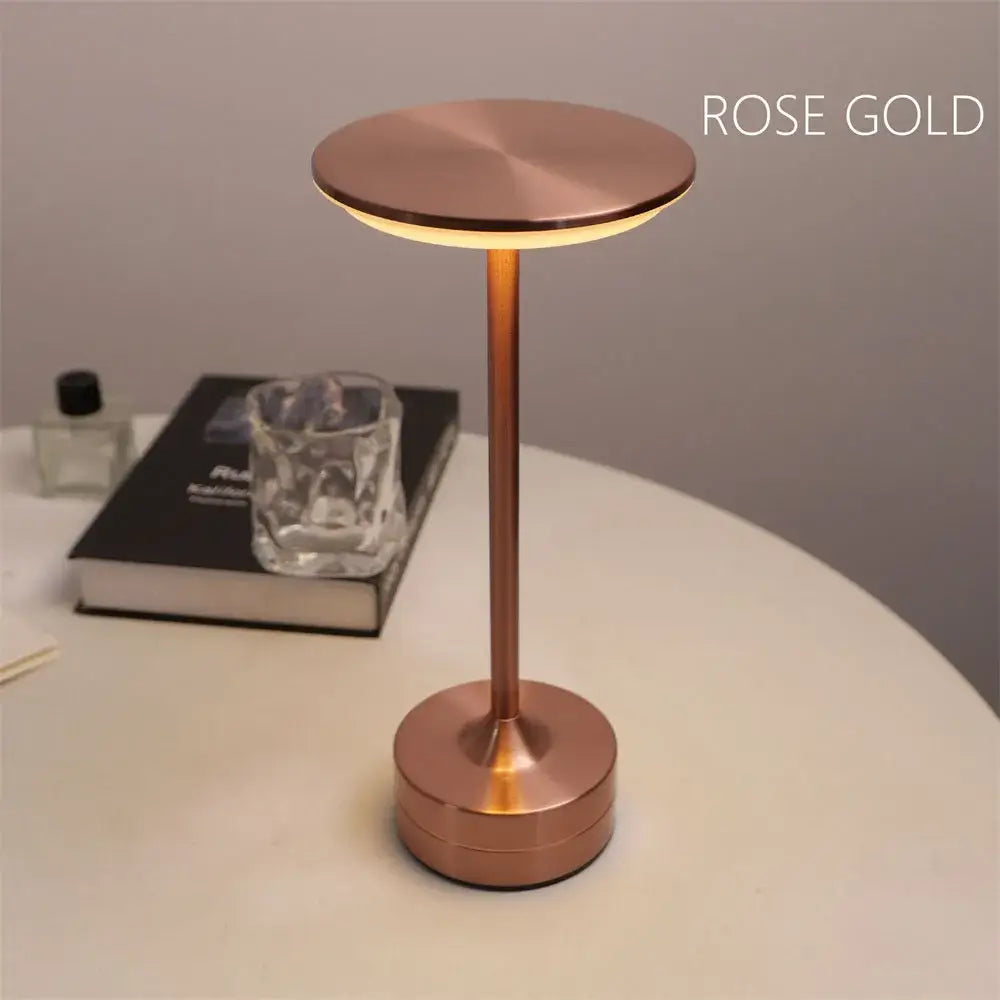 Rose gold minimalist desk lamp with simple charging LED touch control and cylindrical base for restaurant bar use