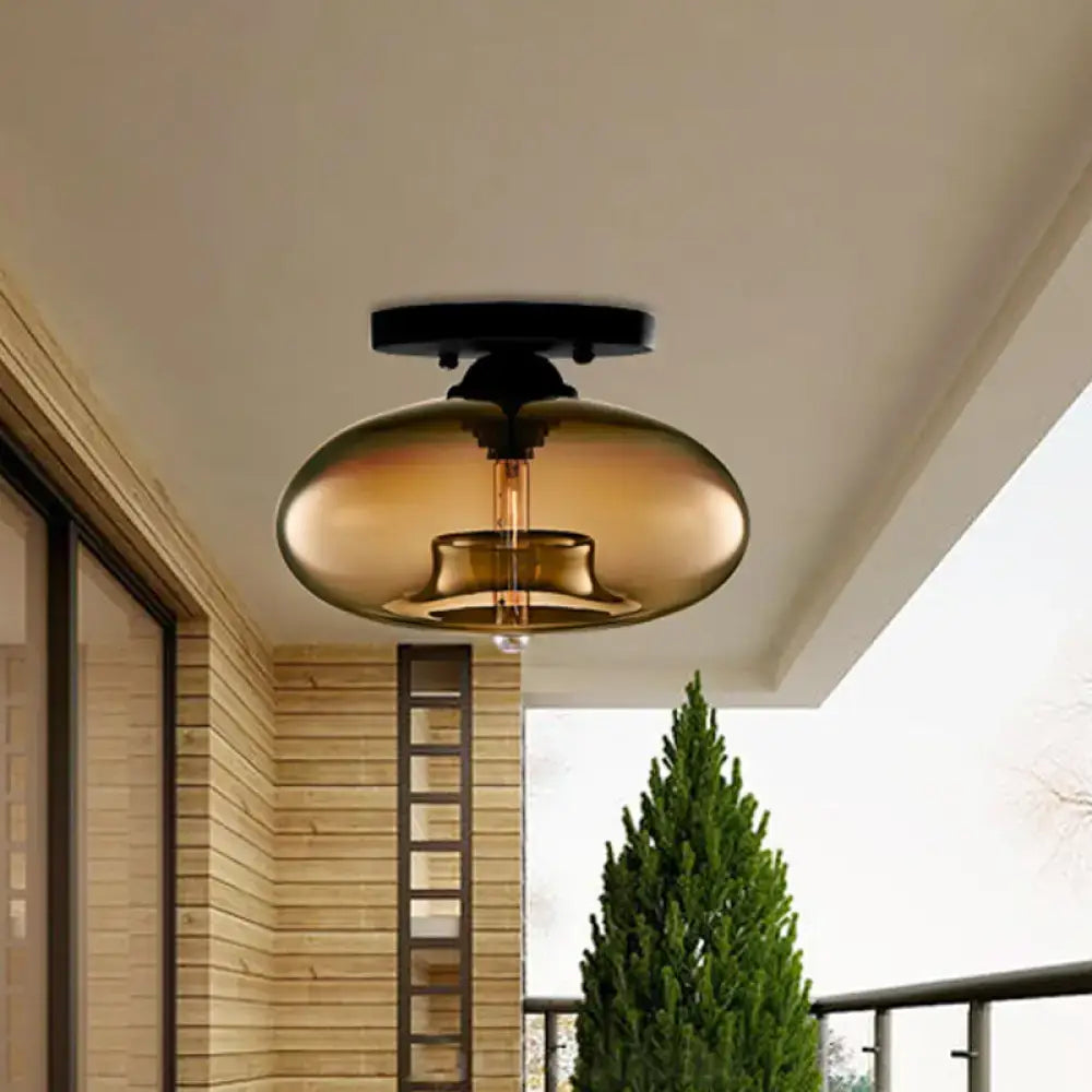 Modern decorbites™ glass oval flush mount lamp with amber-tinted glass dome and black metal base for hallway lighting
