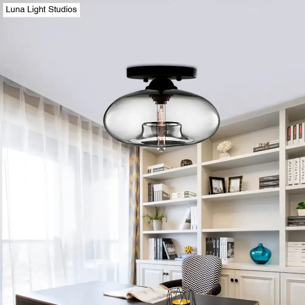 DecorBites™ simple style black flush mount with a glass oval flush smoky shade and exposed filament bulb for hallways